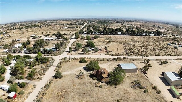 aerial view of sparsely populated area featuring a desert landscape