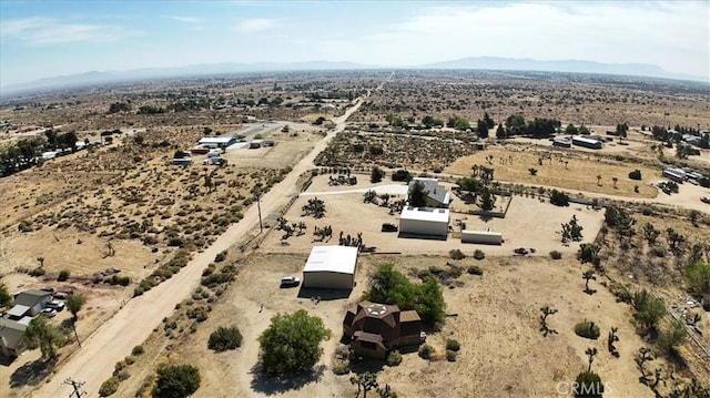 view of property location featuring a desert landscape, rural landscape, and a mountainous background