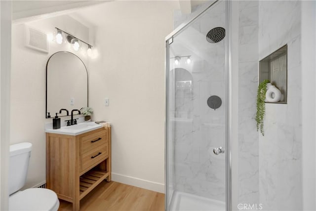417 Delle Dr, Crestline, CA 92325 - full bathroom featuring a marble finish shower, toilet, vanity, wood finished floors, and baseboards