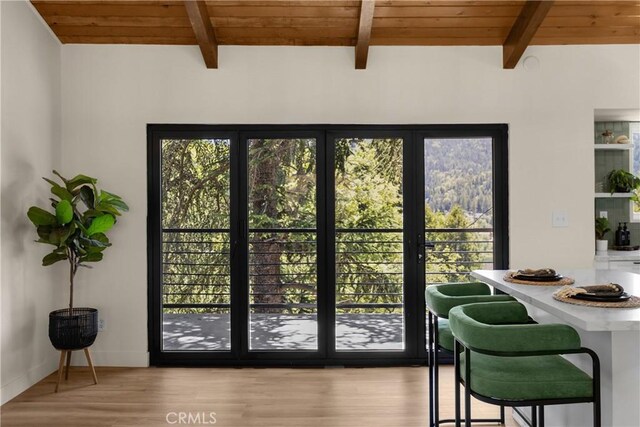 417 Delle Dr, Crestline, CA 92325 - dining space featuring wood ceiling with exposed beams, plenty of natural light, and wood finished floors