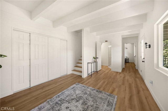 417 Delle Dr, Crestline, CA 92325 - entrance foyer with wood finished floors, beam ceiling, stairs, and baseboards