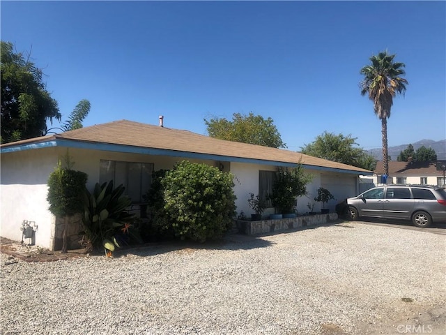 8852 Greenwood Ave, San Gabriel, CA 91775 - view of front of home with an attached garage, stucco siding, and driveway
