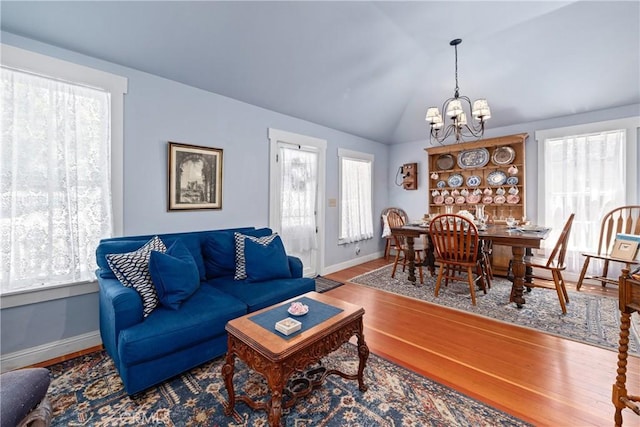 2013 3rd St, Julian, CA 92036 - living area featuring a chandelier, baseboards, wood finished floors, and vaulted ceiling