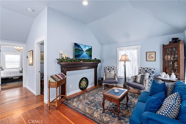 2013 3rd St, Julian, CA 92036 - living area featuring vaulted ceiling, a chandelier, wood-type flooring, and baseboards