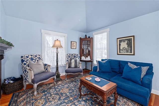 2013 3rd St, Julian, CA 92036 - living area featuring wood finished floors, baseboards, vaulted ceiling, and a fireplace