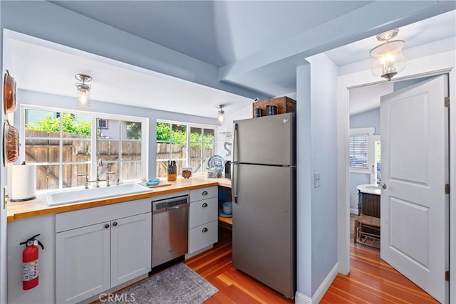 2013 3rd St, Julian, CA 92036 - kitchen with appliances with stainless steel finishes, a sink, and light wood-style floors