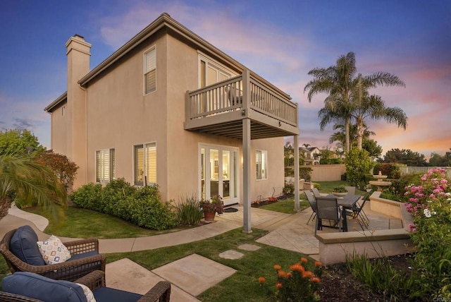 6407 Calmeria Pl, Carlsbad, CA 92011 - rear view of property with french doors, a balcony, a patio, a chimney, and stucco siding