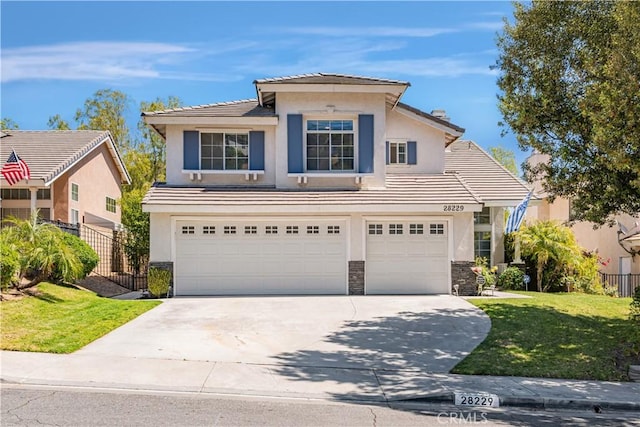 28229 Foothill Rd, Castaic, CA 91384 - traditional-style house featuring an attached garage, a tile roof, stucco siding, concrete driveway, and stone siding