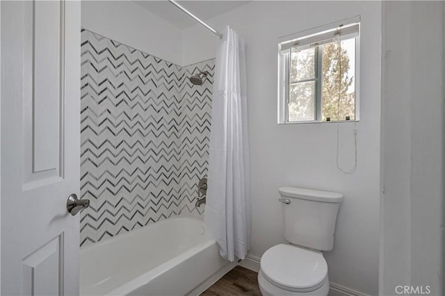 28229 Foothill Rd, Castaic, CA 91384 - bathroom featuring toilet, shower / bath combo with shower curtain, baseboards, and wood finished floors
