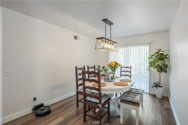 28229 Foothill Rd, Castaic, CA 91384 - dining space with plenty of natural light, wood finished floors, baseboards, and a chandelier