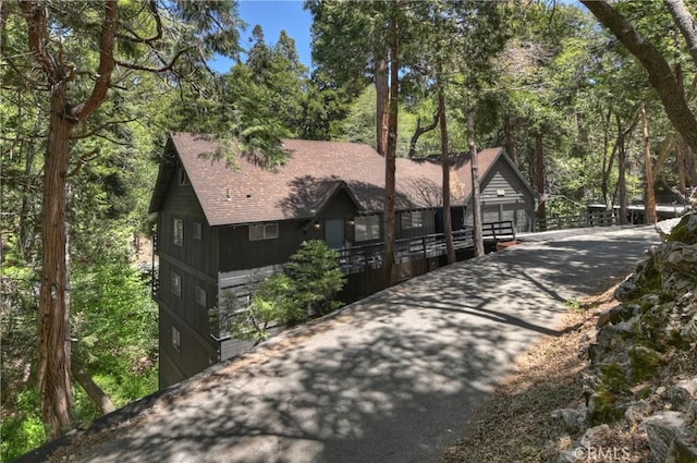 309 Golden Ln, Lake Arrowhead, CA 92352 - rustic home with roof with shingles, a garage, and driveway