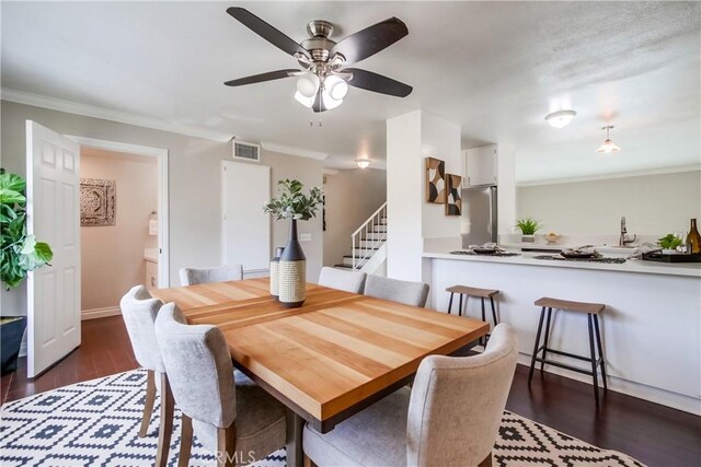 5573 Kiowa Dr, La Mesa, CA 91942 - dining area with dark wood-type flooring, stairway, crown molding, and a ceiling fan