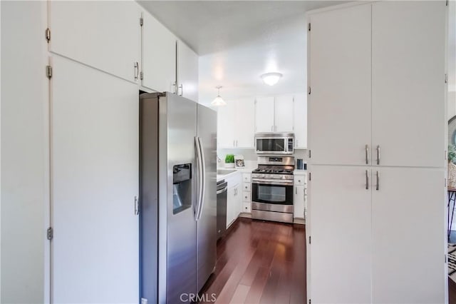 5573 Kiowa Dr, La Mesa, CA 91942 - kitchen featuring appliances with stainless steel finishes, dark wood-style flooring, white cabinetry, and light countertops