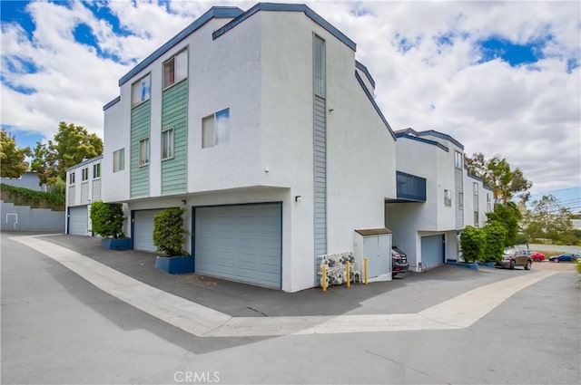 5573 Kiowa Dr, La Mesa, CA 91942 - view of building exterior with an attached garage