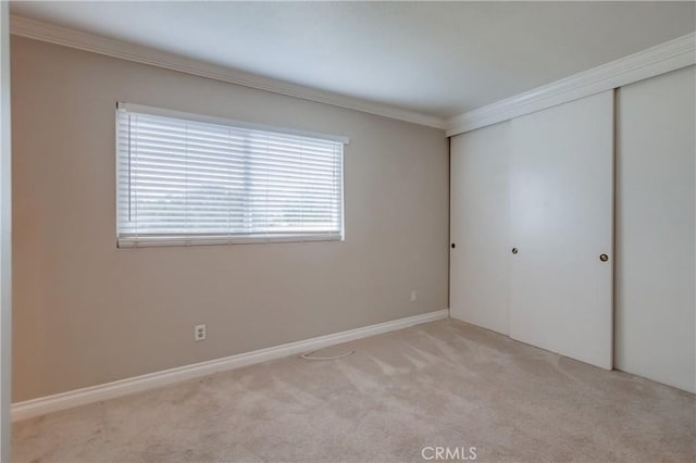 5573 Kiowa Dr, La Mesa, CA 91942 - unfurnished bedroom with crown molding, a closet, and carpet floors