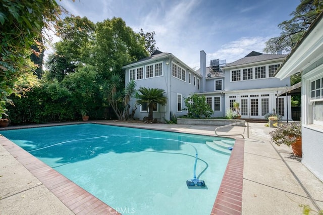605 E Home Ave, Fresno, CA 93728 - swimming pool featuring a patio and french doors