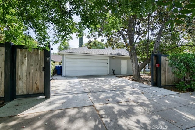 605 E Home Ave, Fresno, CA 93728 - garage with concrete driveway and fence