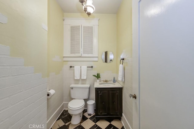 605 E Home Ave, Fresno, CA 93728 - bathroom with toilet, tile walls, and vanity