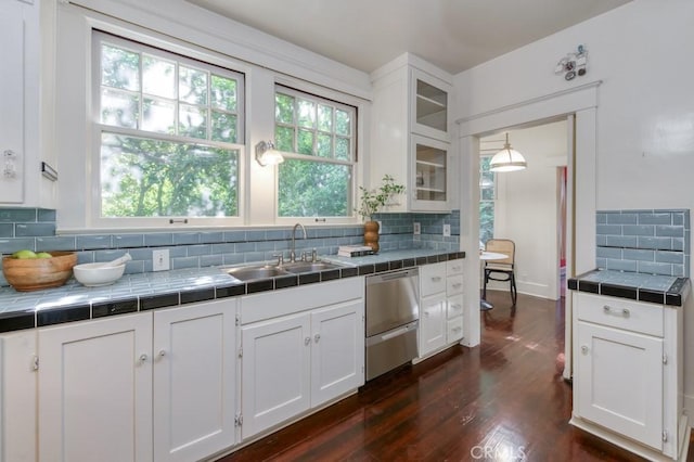 605 E Home Ave, Fresno, CA 93728 - kitchen featuring a sink, tile counters, stainless steel dishwasher, and white cabinets