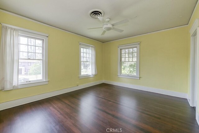 605 E Home Ave, Fresno, CA 93728 - empty room with a ceiling fan, dark wood finished floors, baseboards, and crown molding