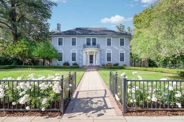 605 E Home Ave, Fresno, CA 93728 - colonial home featuring a chimney and stucco siding
