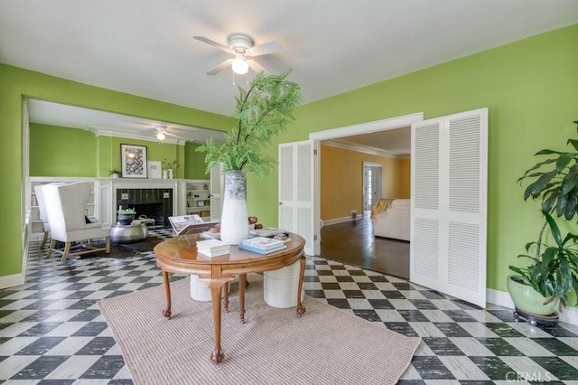 605 E Home Ave, Fresno, CA 93728 - living room with tile patterned floors, a ceiling fan, a tiled fireplace, and baseboards