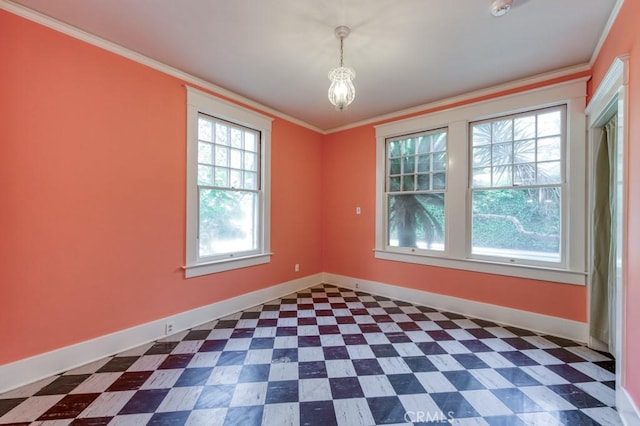 605 E Home Ave, Fresno, CA 93728 - unfurnished room with baseboards, plenty of natural light, crown molding, and dark floors