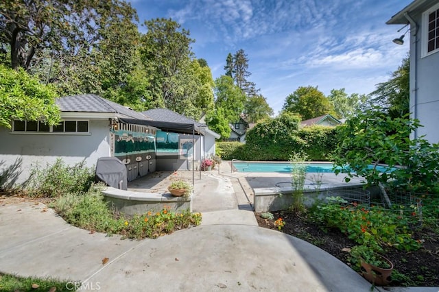 605 E Home Ave, Fresno, CA 93728 - swimming pool featuring a patio