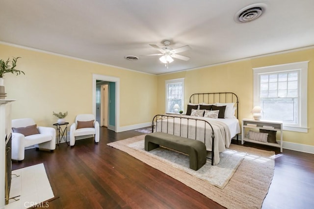 605 E Home Ave, Fresno, CA 93728 - bedroom featuring multiple windows, ornamental molding, dark wood-style flooring, and baseboards