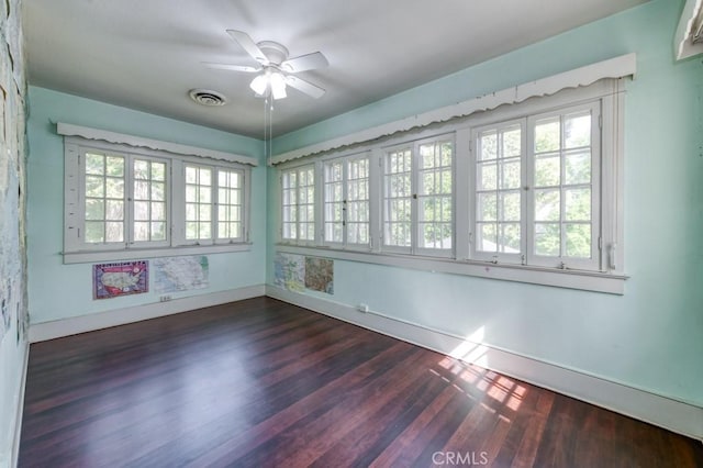 605 E Home Ave, Fresno, CA 93728 - spare room with ceiling fan, dark wood-style flooring, and baseboards