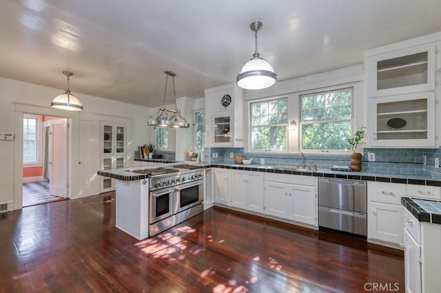 605 E Home Ave, Fresno, CA 93728 - kitchen featuring appliances with stainless steel finishes, white cabinetry, tile counters, a peninsula, and a sink