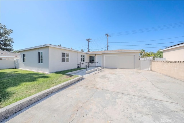 1517 W Romneya Dr, Anaheim, CA 92801 - ranch-style house with driveway, an attached garage, and stucco siding