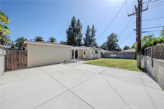 1517 W Romneya Dr, Anaheim, CA 92801 - back of house featuring stucco siding and a patio