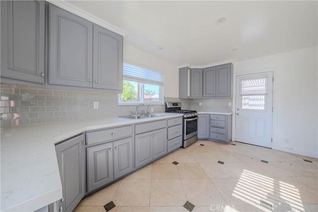 1517 W Romneya Dr, Anaheim, CA 92801 - kitchen featuring stainless steel gas range, gray cabinets, a sink, and light countertops