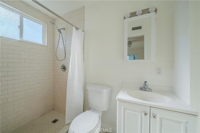 1517 W Romneya Dr, Anaheim, CA 92801 - bathroom with toilet, a tile shower, and vanity