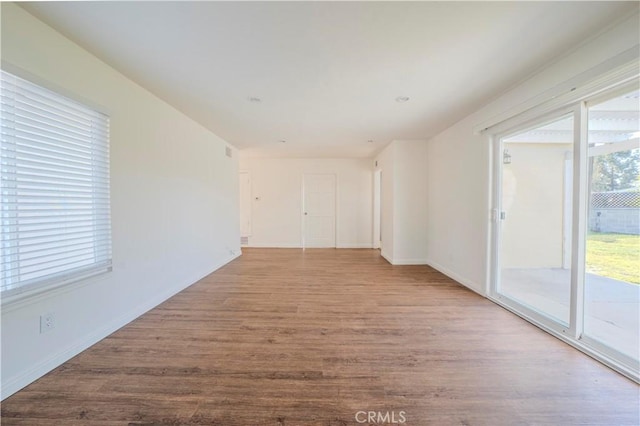 1517 W Romneya Dr, Anaheim, CA 92801 - unfurnished room with wood finished floors and baseboards
