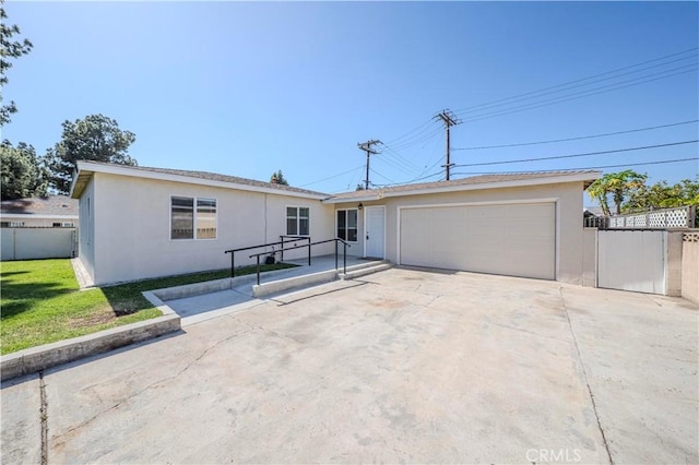 1517 W Romneya Dr, Anaheim, CA 92801 - ranch-style home with stucco siding, a garage, fence, and driveway