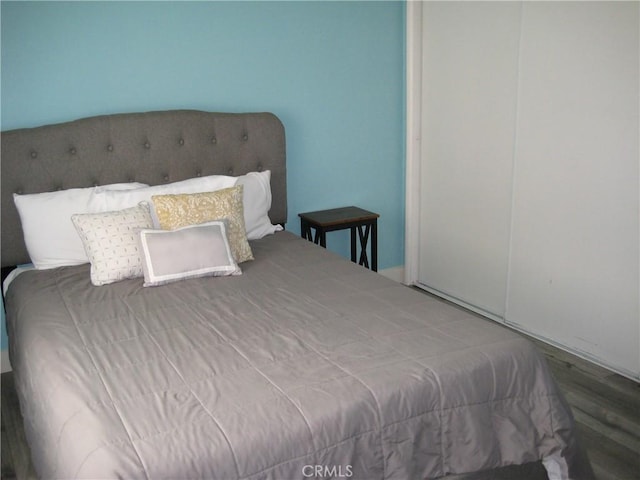 bedroom with wood finished floors
