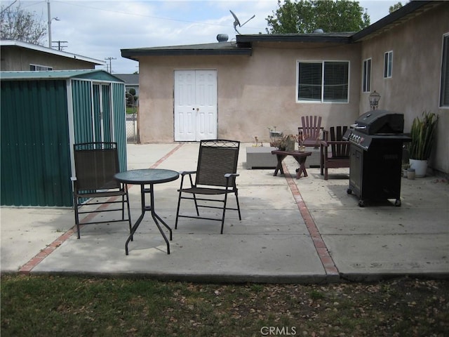 view of patio with a grill