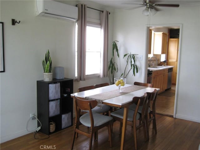dining space with a wall mounted AC, ceiling fan, wood finished floors, and healthy amount of natural light