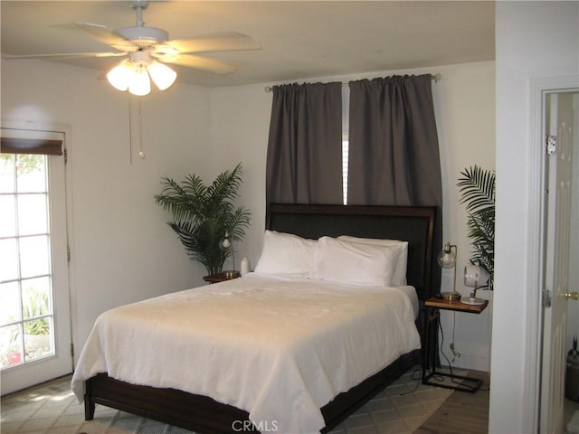 bedroom featuring wood finished floors and ceiling fan