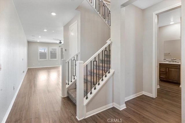 34428 Burnt Pine Rd, Murrieta, CA 92563 - stairway with wood finished floors, baseboards, recessed lighting, and a ceiling fan