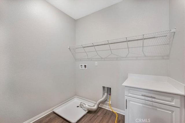34428 Burnt Pine Rd, Murrieta, CA 92563 - washroom with washer hookup, dark wood-style flooring, and baseboards