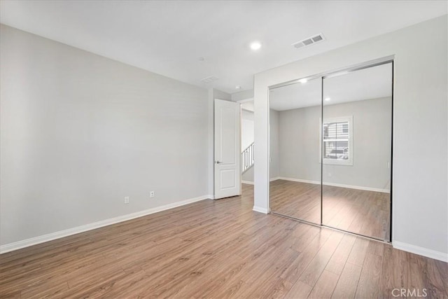 34428 Burnt Pine Rd, Murrieta, CA 92563 - unfurnished bedroom with light wood-type flooring, baseboards, a closet, and recessed lighting