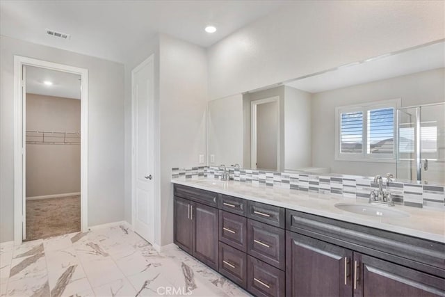 34428 Burnt Pine Rd, Murrieta, CA 92563 - bathroom with marble look tile flooring, backsplash, double vanity, baseboards, and recessed lighting