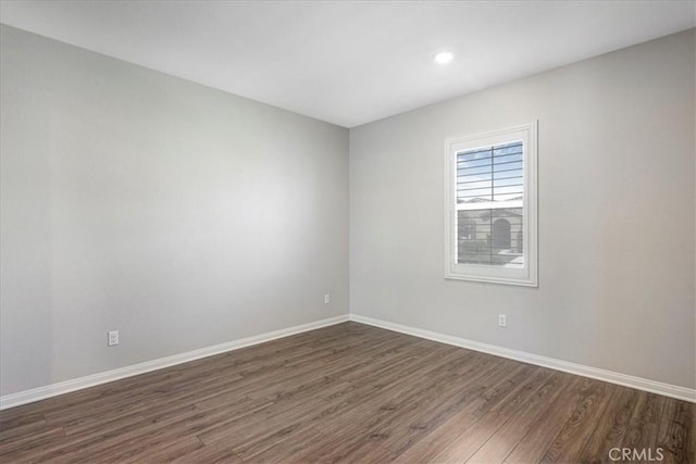 34428 Burnt Pine Rd, Murrieta, CA 92563 - empty room with dark wood-style floors, baseboards, and recessed lighting