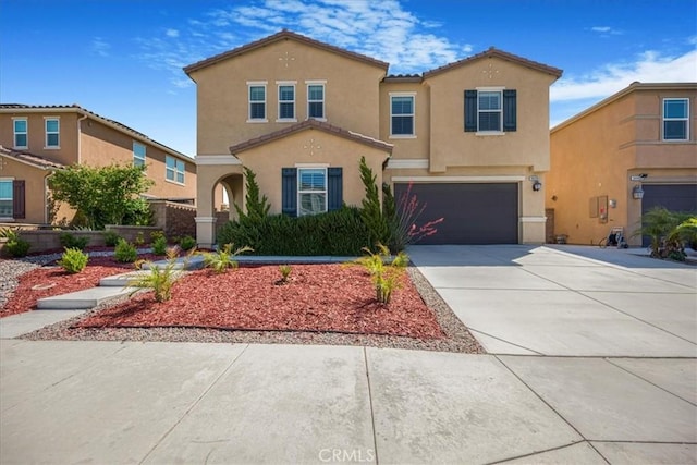 34428 Burnt Pine Rd, Murrieta, CA 92563 - mediterranean / spanish-style house with stucco siding, a garage, driveway, and a tile roof