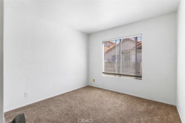 11 Avalon Unit 23, Laguna Niguel, CA 92677 - empty room with carpet and baseboards