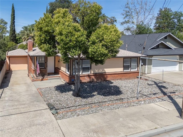 2234 Perkins Ave, Oroville, CA 95966 - view of front of home with brick siding, driveway, and fence