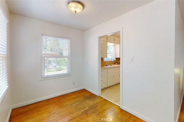 2234 Perkins Ave, Oroville, CA 95966 - spare room with light wood finished floors, baseboards, and a sink